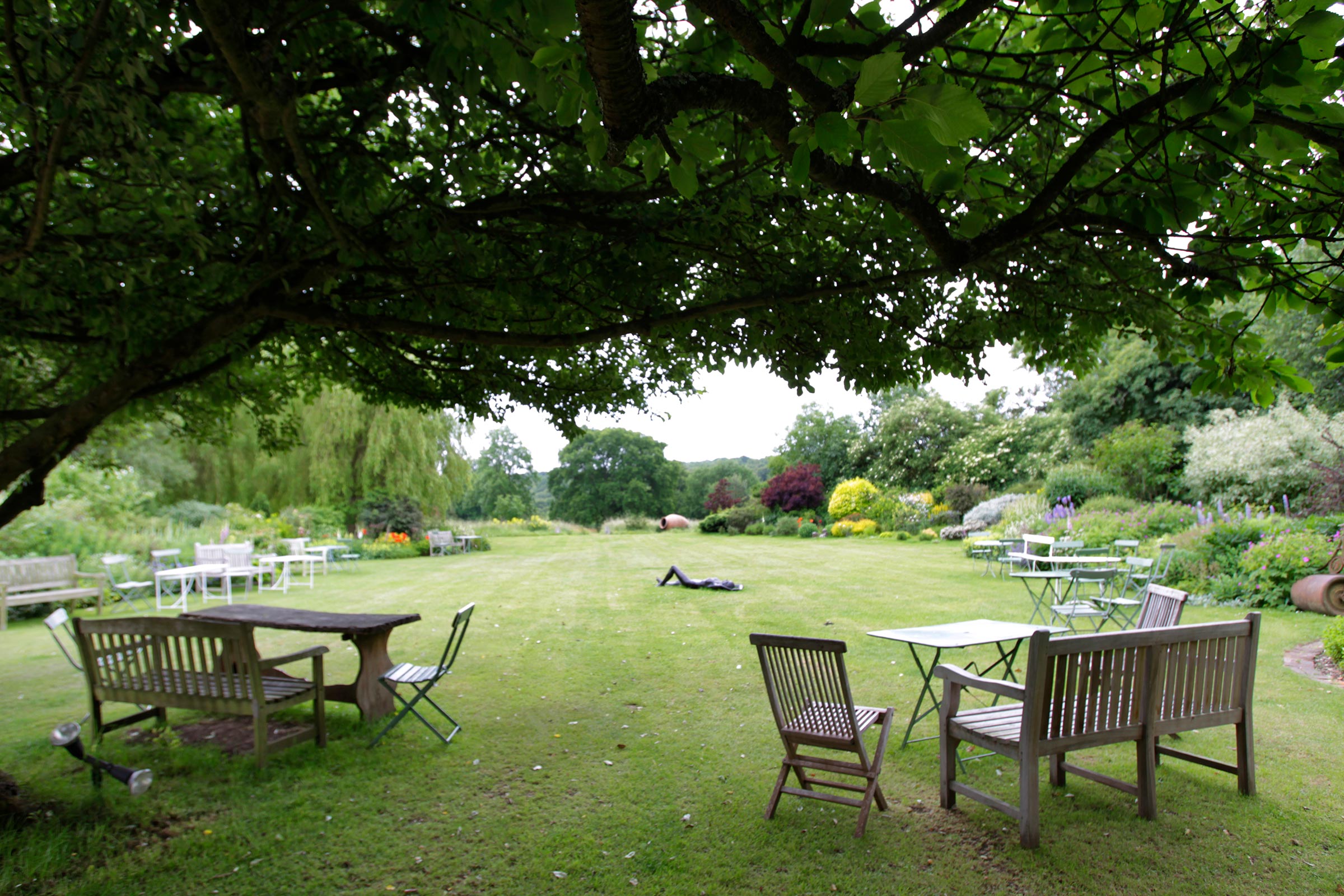 Garden, showing lawn and tables from the terrace.